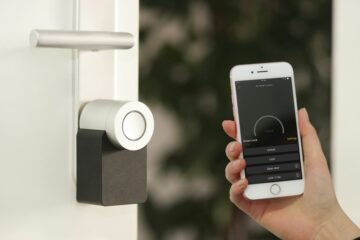 Smart home app on smartphone controlling connected devices