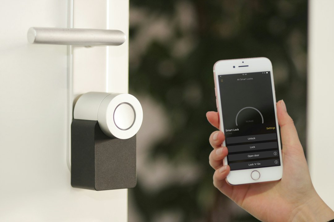Smart home app on smartphone controlling connected devices