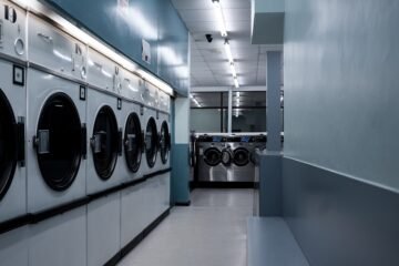 White front load washing machine and dryer in a clean laundry room